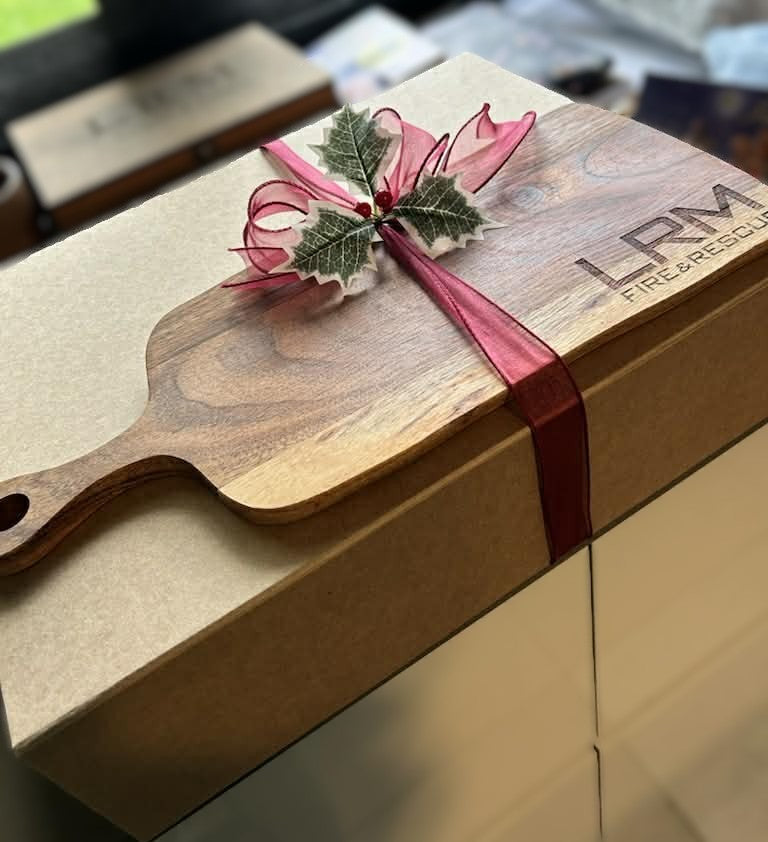 Personalised engraved wooden serving board presented as a Christmas gift